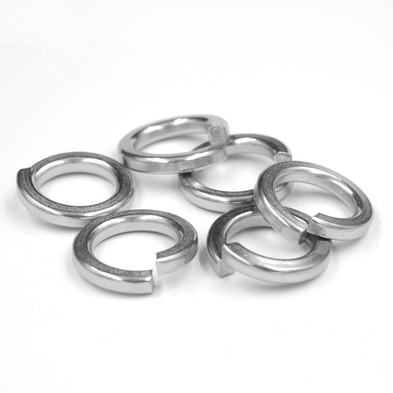 Can spring washers and flat washers be used interchangeably?